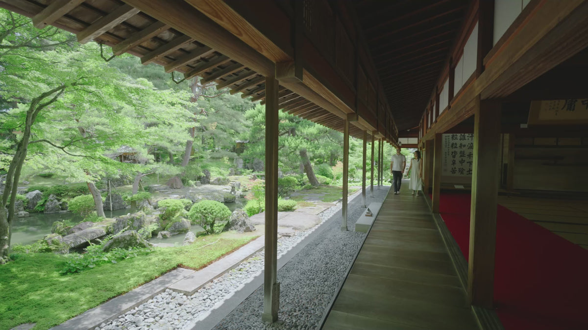 A quiet temple walkway looking out over a Japanese garden